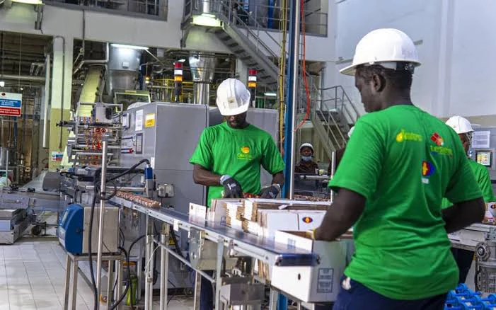 Industrial production line and operators during the OLEOSEN project in Dakar